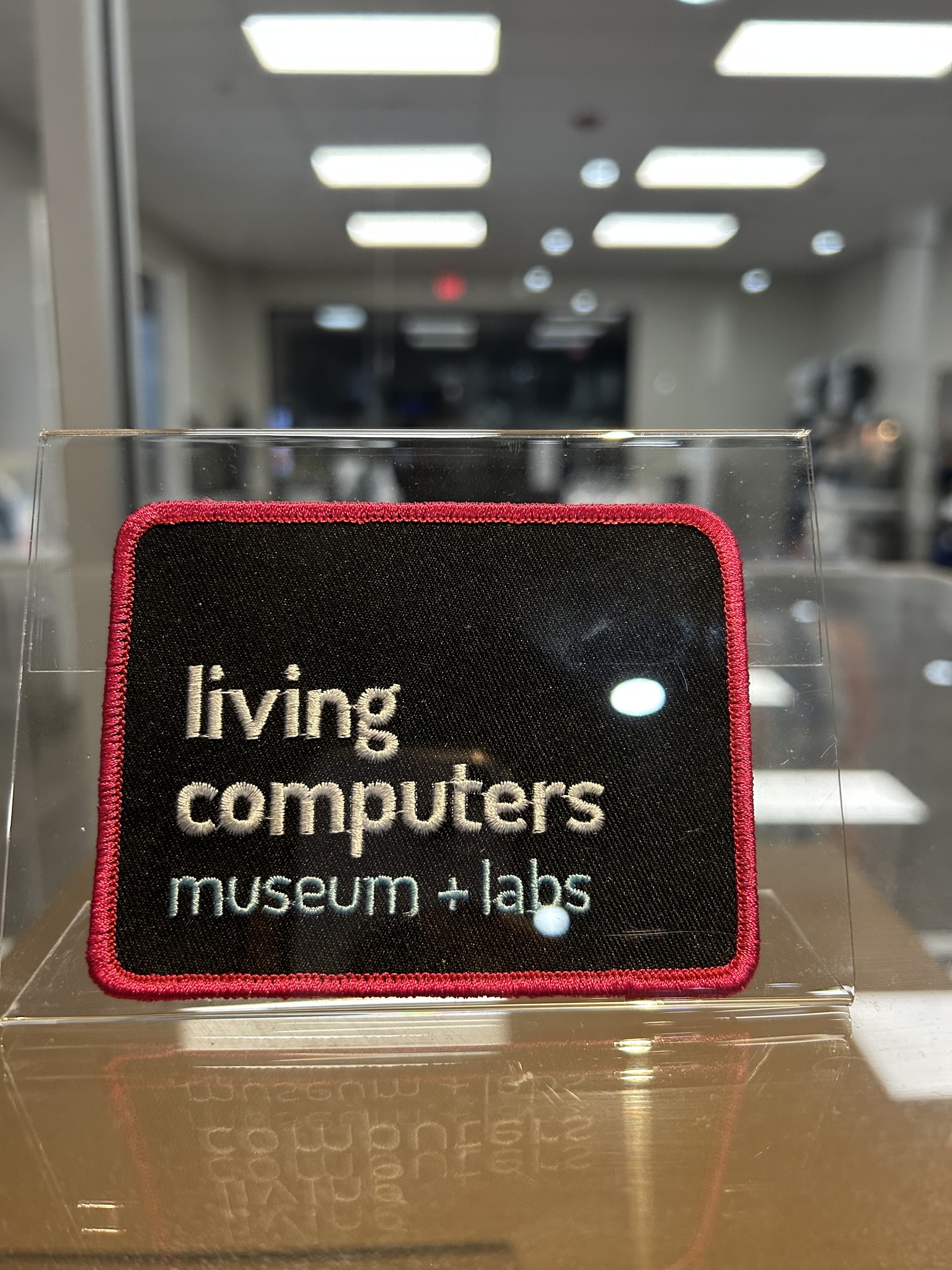 Living Computers Museum patch displayed with collection materials